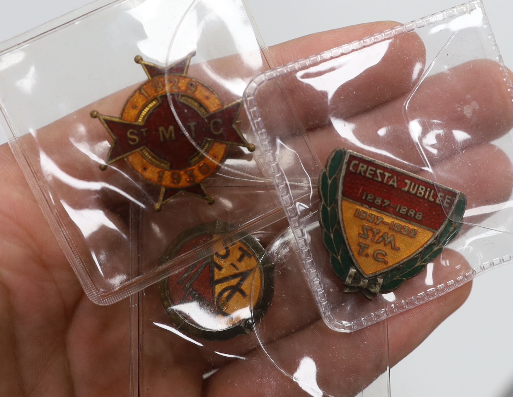 Three enamel 1930s Cresta Run, St. Moritz ice racing toboggan track lapel badges and a Bobsleigh Challenge Cup badge, together with a collection of 46 Aden related postcards from the early 20th century
